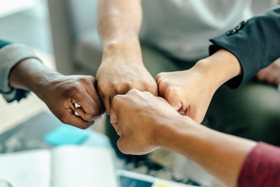 four-way-fist-bump-at-work_925x-min